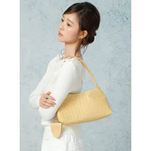 Chic yellow woven shoulder bag detail, elegant design, perfect for casual and versatile style.