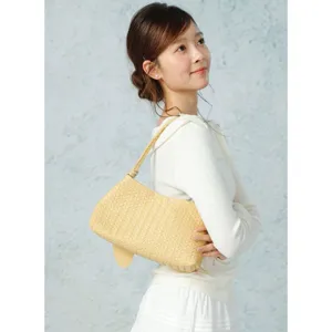 Chic woven leather shoulder bag for women, stylish underarm baguette handbag with large capacity.