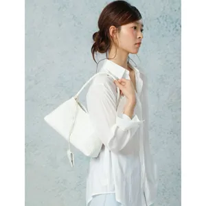 Chic white woven underarm shoulder bag showcasing exquisite hand-woven craftsmanship detail.