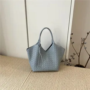 Woven leather handbag for women, large capacity shoulder tote bag in stylish light blue.