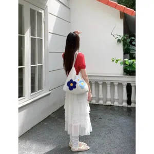 Summer casual knitted shoulder bag with cute floral design. Spacious woven tote for women.