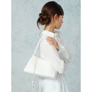 White woven shoulder bag detail view, premium intrecciato leather handbag style for women.