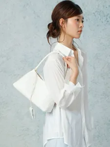 Elegant white woven shoulder bag for women, chic French style faux leather underarm handbag.