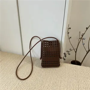Detailed view of the brown woven leather mini crossbody phone bag, perfect for daily casual use.