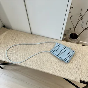 Light blue woven mini crossbody phone bag, chic daily commuting shoulder pouch for women.