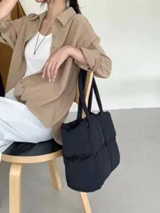 Black winter puffer shoulder bag, large capacity quilted tote for daily commute and stylish look.