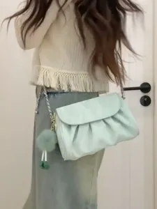 Light green ruched cloud shoulder bag with plush pendant and chic chain strap for daily.
