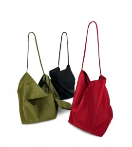 Slouchy large shoulder bag for women, minimalist daily commuter bucket bag with soft leather.
