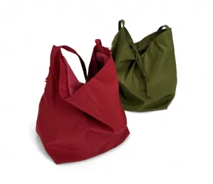 Minimalist slouchy nylon shoulder bag for women, casual large capacity daily commuting tote.