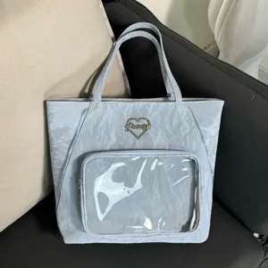 Light blue ripple pain bag featuring clear front pocket and stylish heart metal logo daily use
