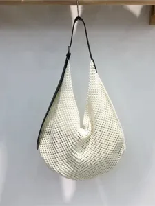 Chic hollow-out patchwork woven shoulder bag, perfect for summer casual beach vacation.