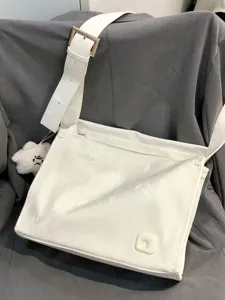 White glossy large capacity crossbody shoulder bag with wide strap, casual commuter tote.