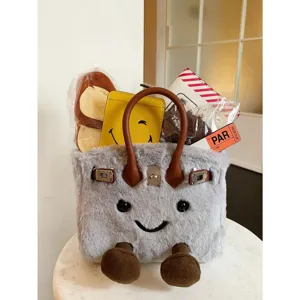 Cute cartoon smiley plush handbag winter fashion shoulder bag with cute furry design details.