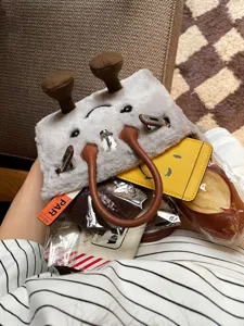 Cute cartoon plush handbag with unique shape, soft material and spacious interior for women.