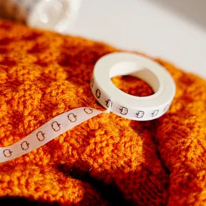 Halloween black pumpkin pattern washi tape detail view, decorative craft masking tape.