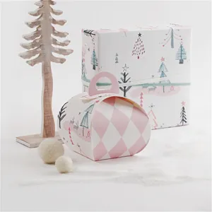 Nordic pink Christmas gift box for cookies, nougat, and candy with cute tree and argyle patterns.
