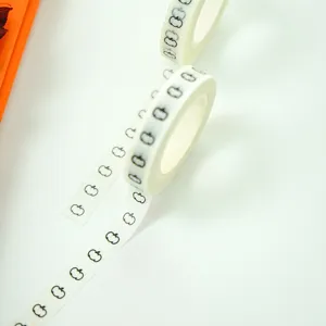 Closeup of black pumpkin washi tape detail, perfect for journal decoration and crafts projects.