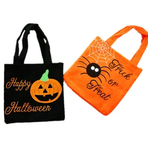Halloween fabric tote bag, candy gift bag with pumpkin and spider design for holiday party.
