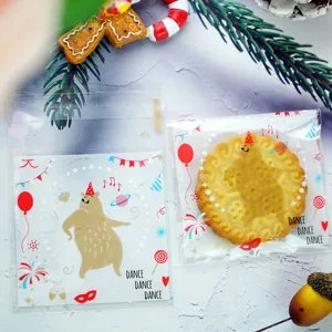 Close-up detail of self-adhesive cookie packaging bags featuring cute dancing bear design.