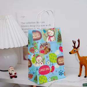 Christmas blue paper gift bag with snowman and reindeer details, festive packaging.