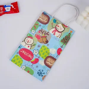Blue Christmas paper gift bag with cute snowman and reindeer prints, ideal holiday packaging.