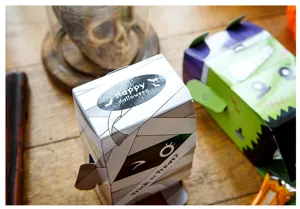 Halloween standing gift paper box, cute mummy candy container for party treats and festival decor.