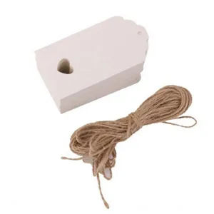 White paper tags with heart cutout and jute string for DIY wedding gifts and party favors.