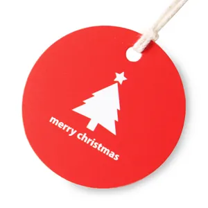 Red round Christmas tree gift tag with white string for holiday party decoration packaging label