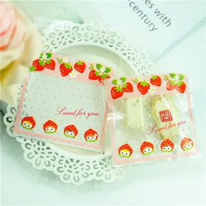 Close-up detail of cute strawberry cartoon self-adhesive candy packaging bags for gifts.