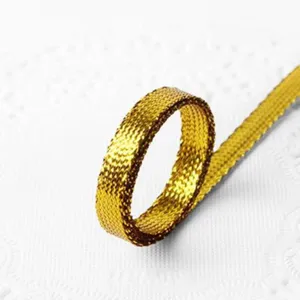 Gold metallic woven ribbon trim for DIY handmade crafts and gift wrapping decoration.