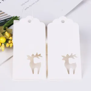 White paper gift tags with hollow reindeer design, perfect for Christmas DIY crafts.