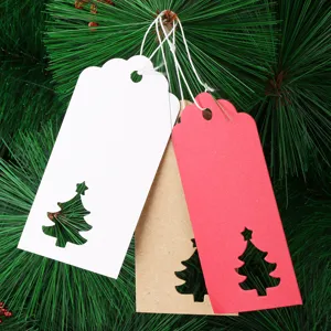 Hollow Christmas tree paper tags detail, craft paper gift labels with hanging strings.
