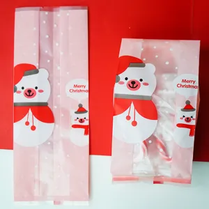 Pink Christmas candy packaging bag with cute bear design, perfect for holiday treats.