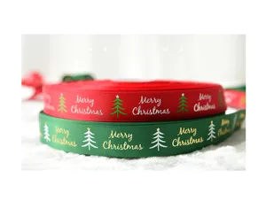 Close-up detail of red and green Christmas ribbons with festive tree and text prints for DIY crafts.