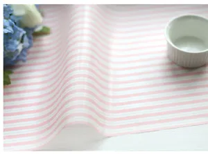 Pink and white striped greaseproof baking paper detail, ideal for food wrapping and boxes.