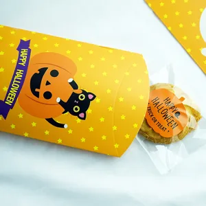 Halloween pillow paper box detail showing cute pumpkin cat print and cookie packaging.