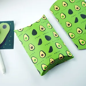 Close-up of cute avocado pattern paper pillow box, perfect for small gifts and snacks packaging.