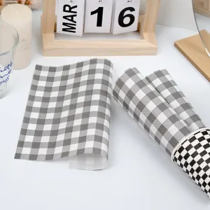 Grey plaid baking oil paper detail view, greaseproof wrapper for cakes, sandwiches and pastries.