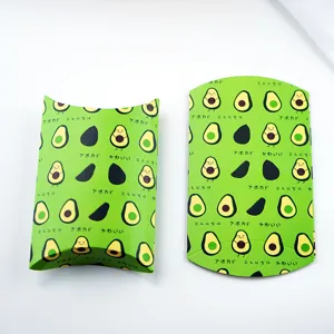Detail view of green avocado printed paper pillow boxes, perfect for cookie and candy packaging.
