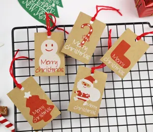 Kraft paper Christmas gift tags with red strings, holiday decorative hanging tags for DIY crafts.