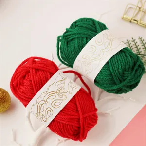 Red and green wool yarn balls detail shot, decorative twine for DIY craft projects