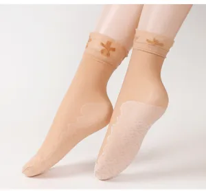 Sheer short socks with delicate lace floral cuff and non-slip sole design, perfect for summer.