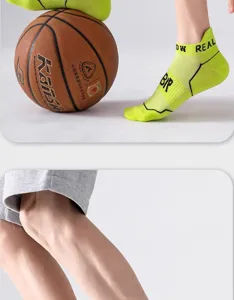 Detailed view of neon green athletic short socks featuring breathable mesh design and stylish letter prints.
