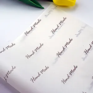 Translucent baking parchment paper with "Hand Made" print, ideal for wrapping gifts and pastries.