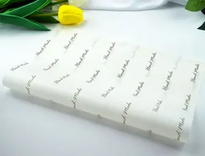 Detail view of handmade style greaseproof wrapping paper with printed English text patterns.