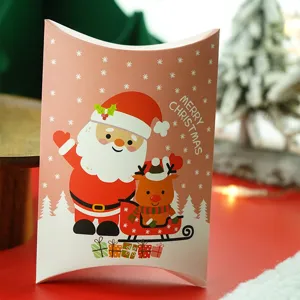 Christmas pillow candy gift paper box with cute Santa Claus and reindeer design for holidays.
