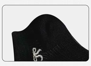 Close-up detail of women's black breathable mesh short socks with knitted white letter accent.