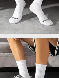 Men white athletic long socks with letter print, comfortable cotton breathable crew socks.