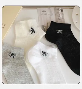 Korean style breathable mesh short socks for women with cute bow embroidery for summer daily wear.