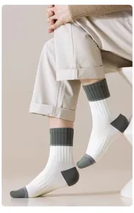 Men's mid-calf socks detail showing contrast color design, comfortable and breathable fabric.
